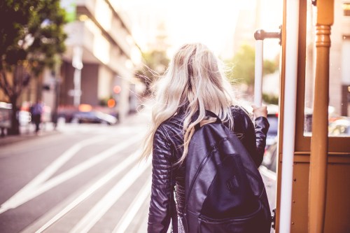 young-woman-enjoying-ride-on-an-iconic-cable-car-in-san-francisco-picjumbo-com.jpg